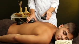 Massage aux pierres chaudes Nyon et Genève